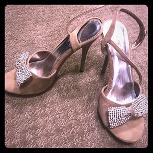 Gorgeous pair of rhinestone bow heels. Size 7